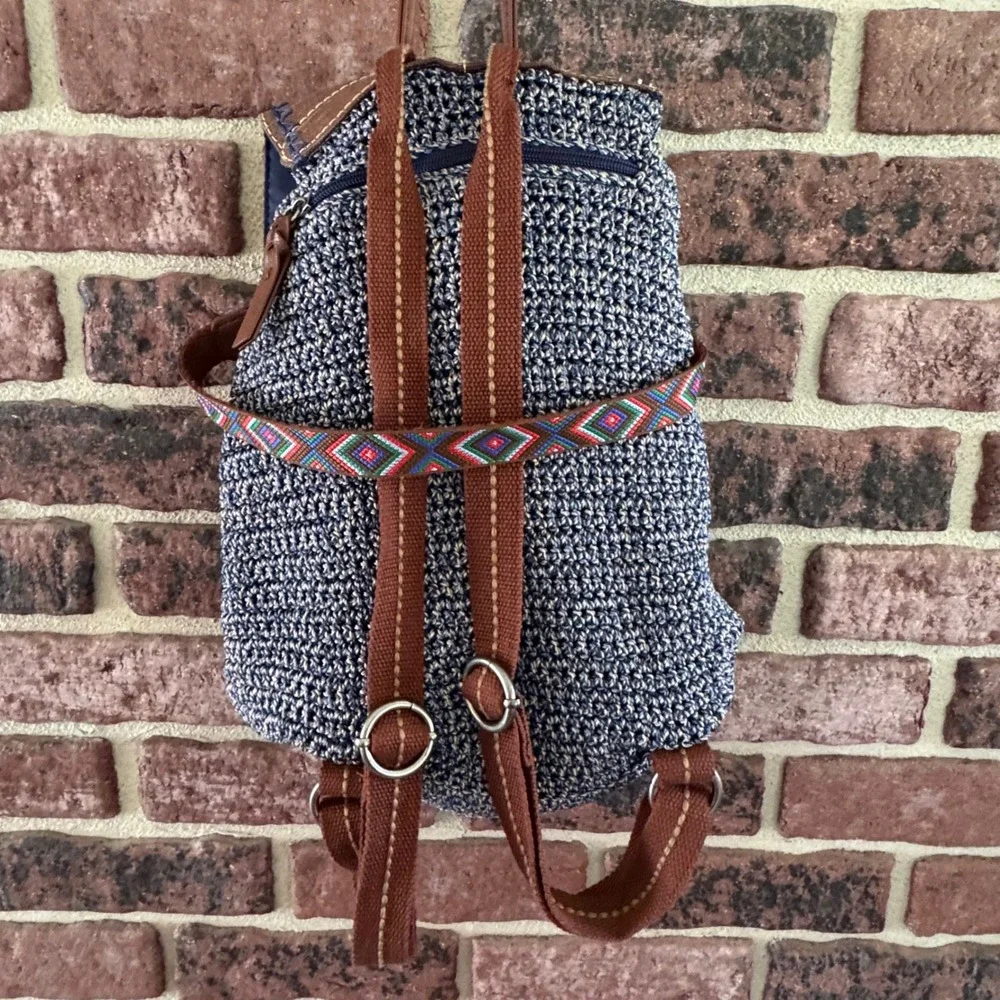 The Sak Brown & Navy Woven Backpack with Tassel Fringe and Embroidered Strap